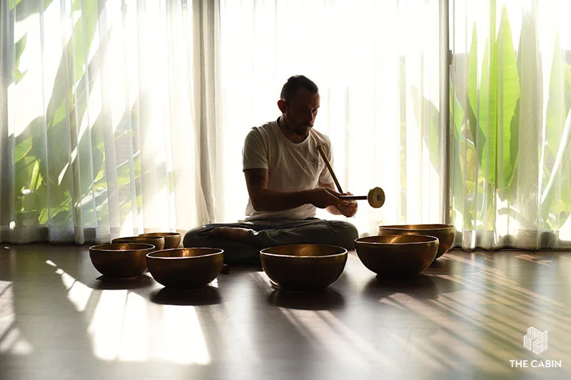 Sound vibrations enhance meditation, relieve stress, and improve health. Sound Bowl Therapy at The Cabin.